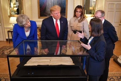 Trump and Britain's Theresa May view a draft of the Declaration of Independence