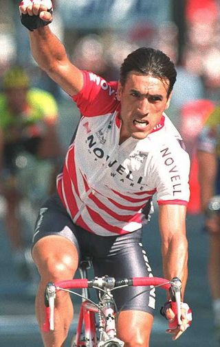 PARIS FRANCE JULY 23 Uzbek sprinter Djamolidine Abdoujaparov raises his arm in victory as he crosses the finish line 23 July in the ChampsElysTes in Paris to win the final stage of the Tour de France between SainteGenevievedesBois and Paris Miguel Indurain of Spain won his fifth consecutive Tour ahead of Swiss Alex Zuelle and Danish Bjarne Riis AFP PHOTO Photo credit should read PASCAL PAVANIAFP via Getty Images