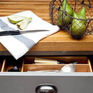Open kitchen drawer, cutlery, solid oak worktops
