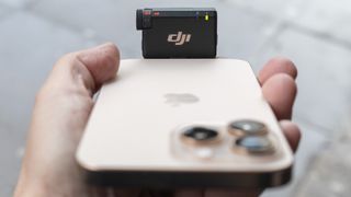 DJI Mic Mini RX connected to iPhone 16 Pro Max in street