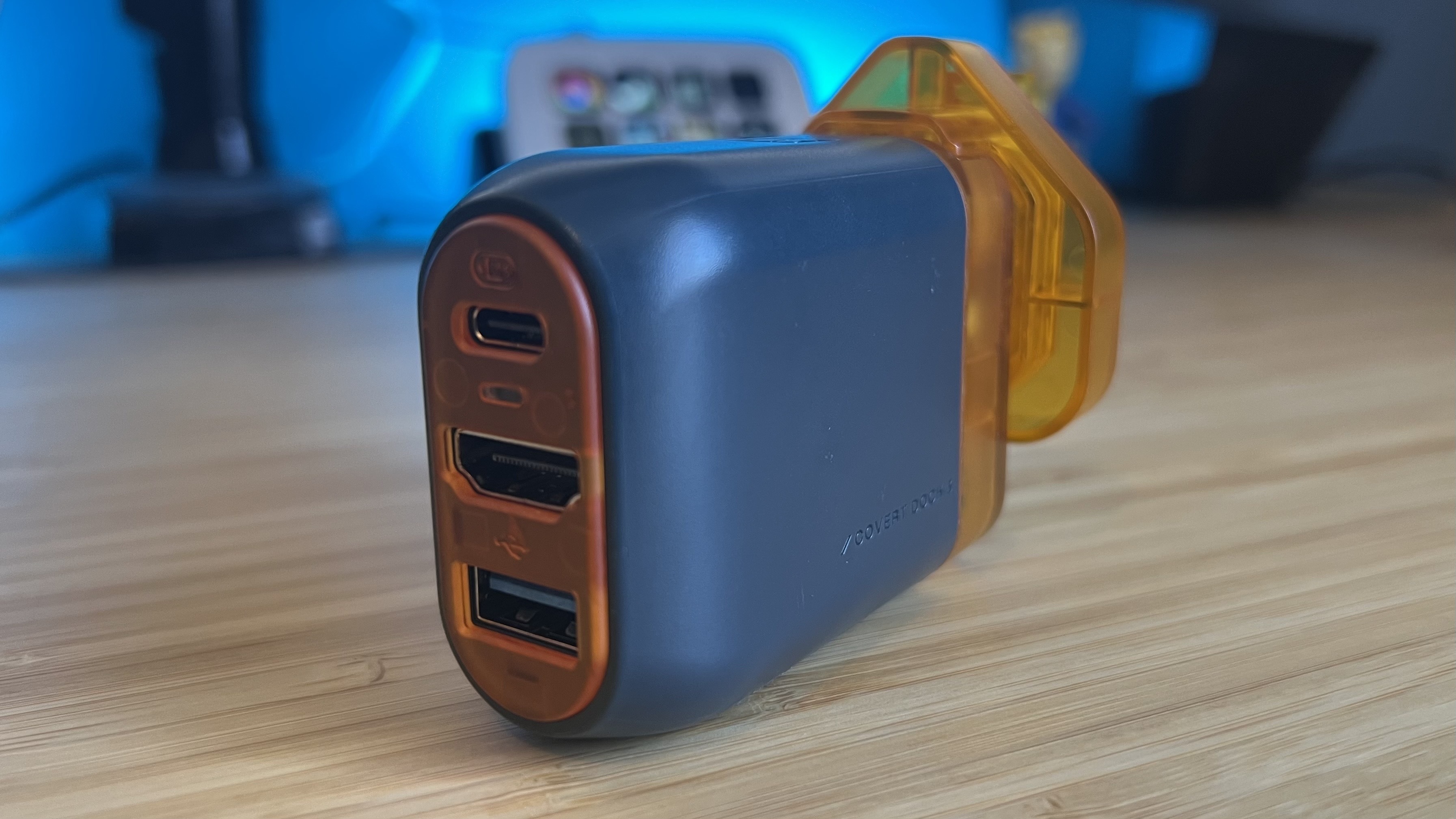 Genki Covert Dock 3 with ports facing the camera on a wooden desk