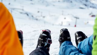 Ski Boots In A Snowy Mountains Landscape