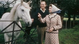 Queen Elizabeth II and Prince Philip visit a farm on the Balmoral estate in Scotland, during their Silver Wedding anniversary year