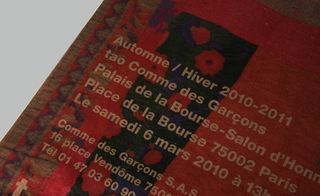 A lacquer effect, tissue paper invitation to the tao Comme des Garçons show