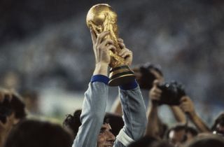 Italy goakeeper Dino Zoff lifts the World Cup trophy in 1982.