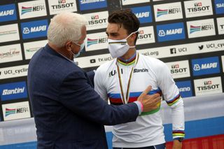 Deceuninck-QuickStep’s Patrick Lefevere (left) congratulates his rider Julian Alaphilippe after winning the 2020 World Championships road race for France in Imola, Italy