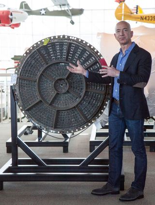 A recovered Saturn V booster element is showcased by Jeff Bezos, who financed an ocean recovery of Apollo-era hardware.