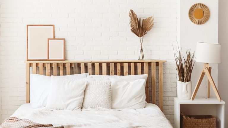 bed with wooden headboard