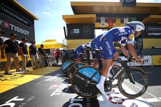 Quick-Step take off from the start house for stage 3