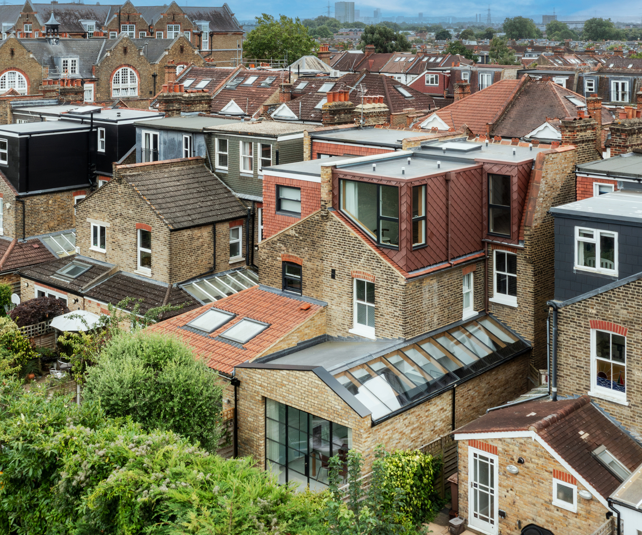 view of the house from above with roof lights on kitchen extension and loft extension