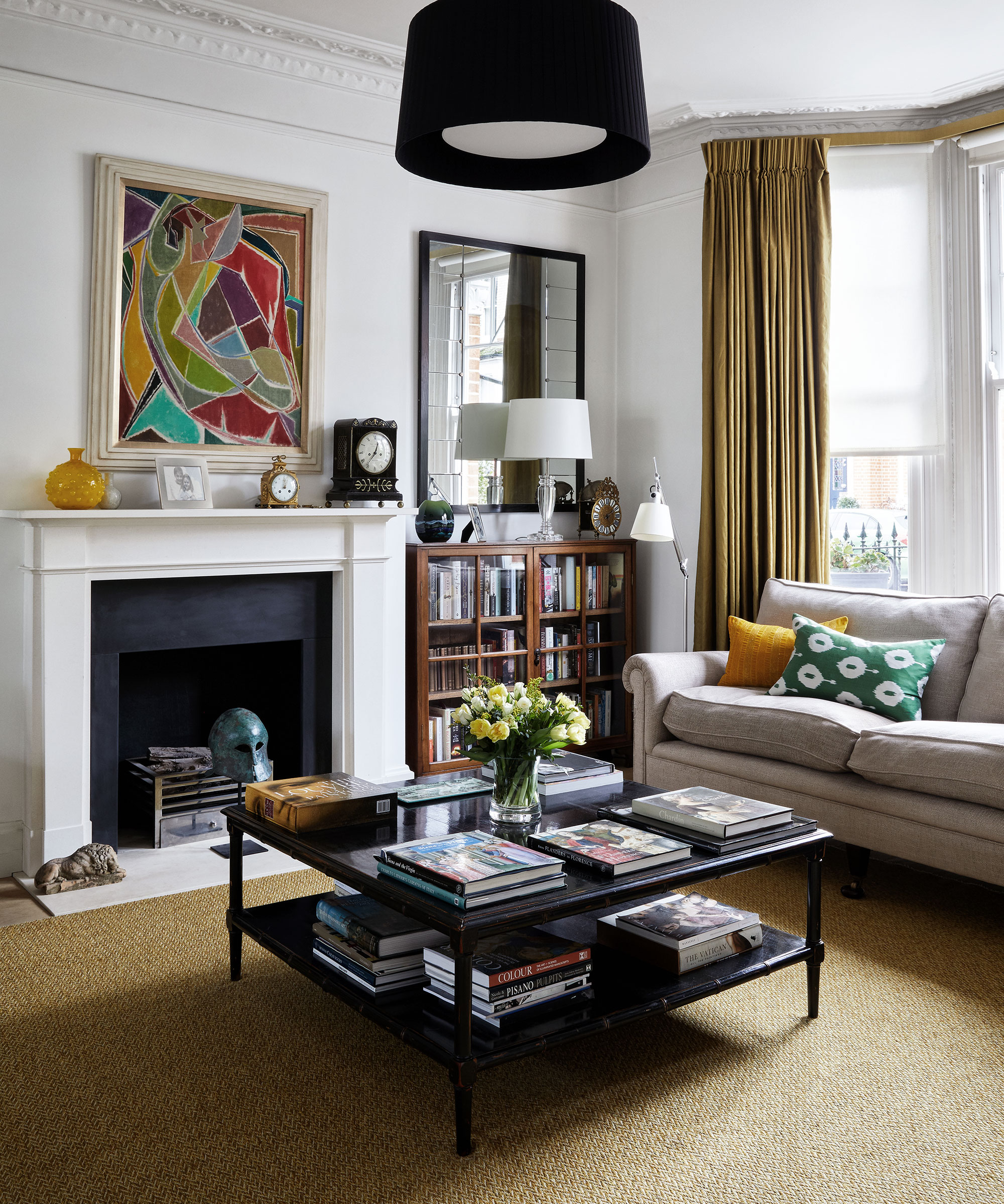 Living room with natural carpet, white walls and fireplace