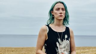 Rona (Saoirse Ronan) stands alone in "The Outrun"