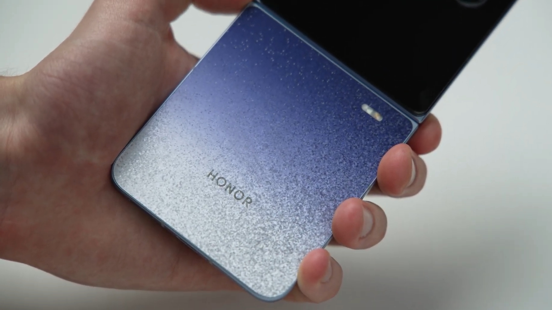 The Honor Magic V Flip 2 being held in the hand