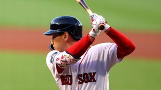 Masataka Yoshida #7 of the Boston Red Sox warms up in the on deck circle 