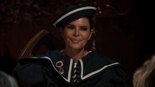 Lisa Rinna smiling at the Traitors' banquet.