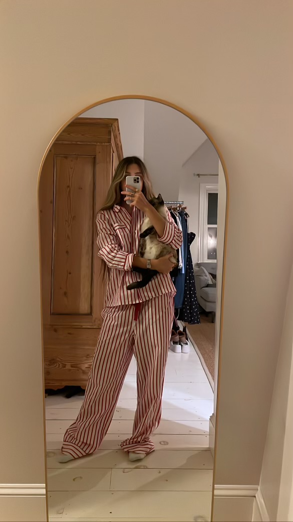 Larissa Mills's daughter Ella wearing a red and white striped pajama set