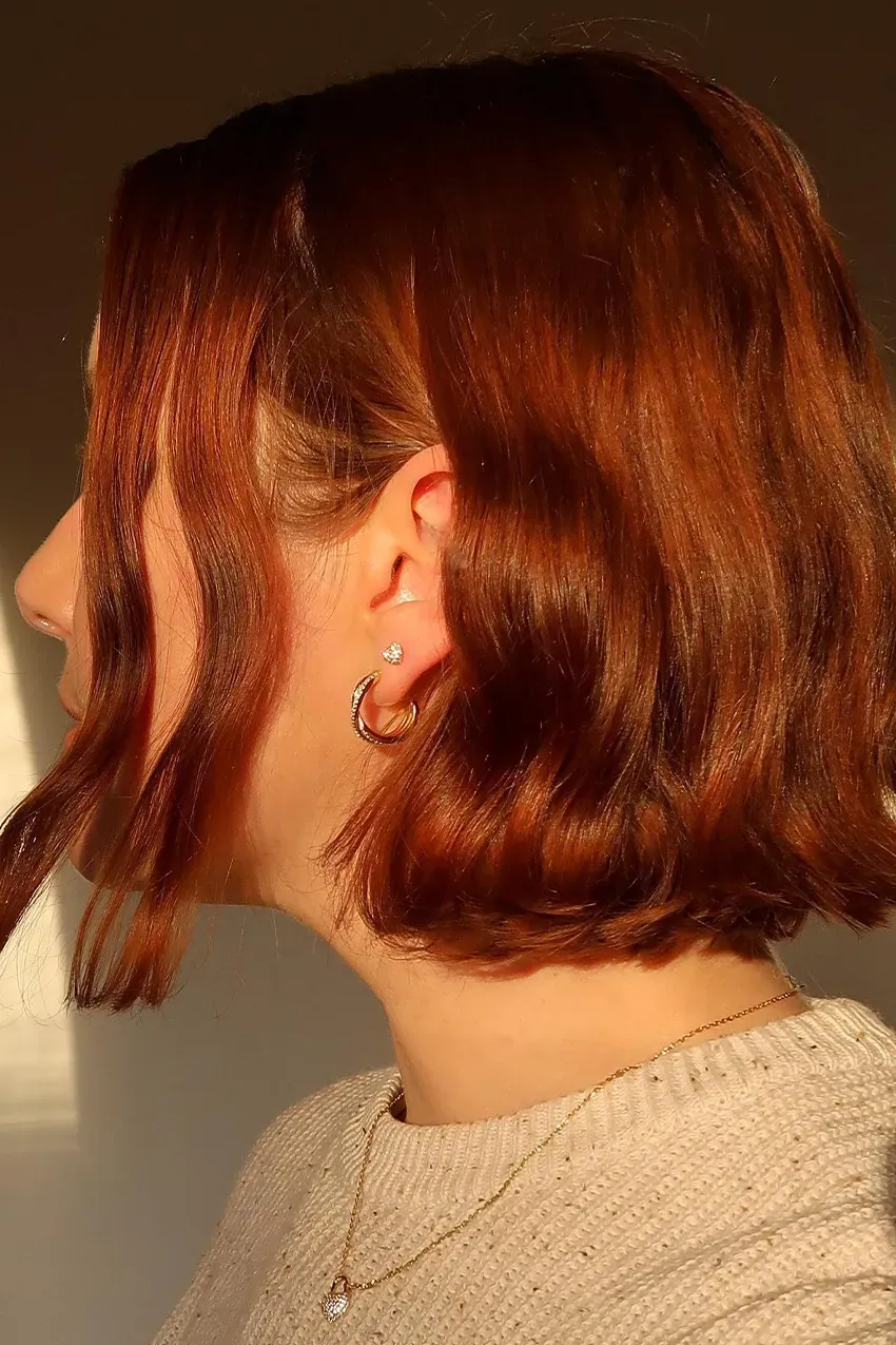 Woman wears diamond hoop earrings