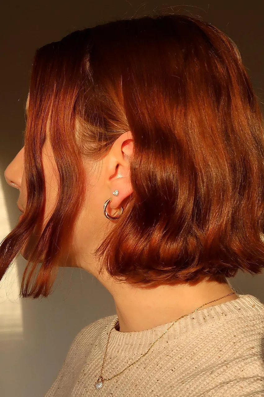 Woman wears diamond hoop earrings