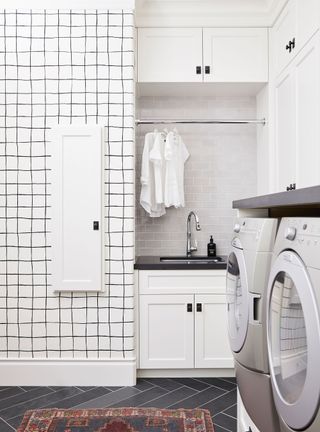 small laundry room with monochrome color scheme