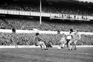 Chris Hughton scores for Tottenham against Coventry City at White Hart Lane with the Shelf in the background, 1981