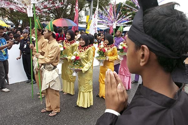 Malaysian performers await their call-up to appear at the festivities in Tampin.