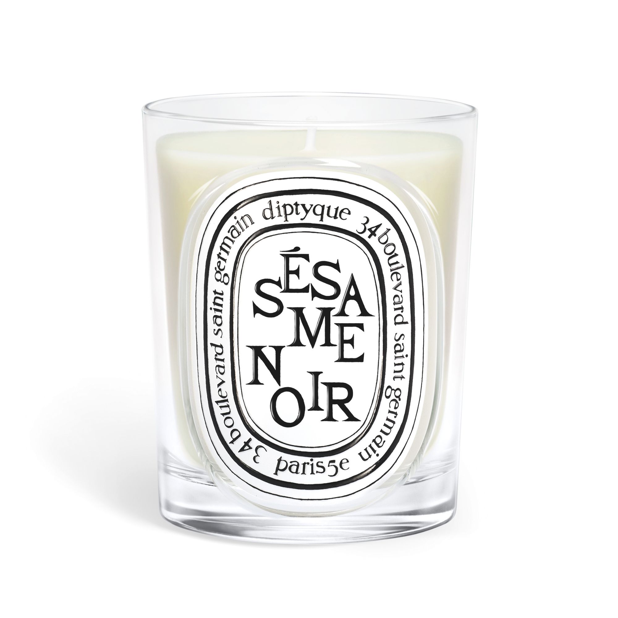 One of the new Diptyque candles, the sesame noir, on a white background