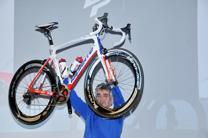 Marc Madiot holds up the team's 2014 racing machine
