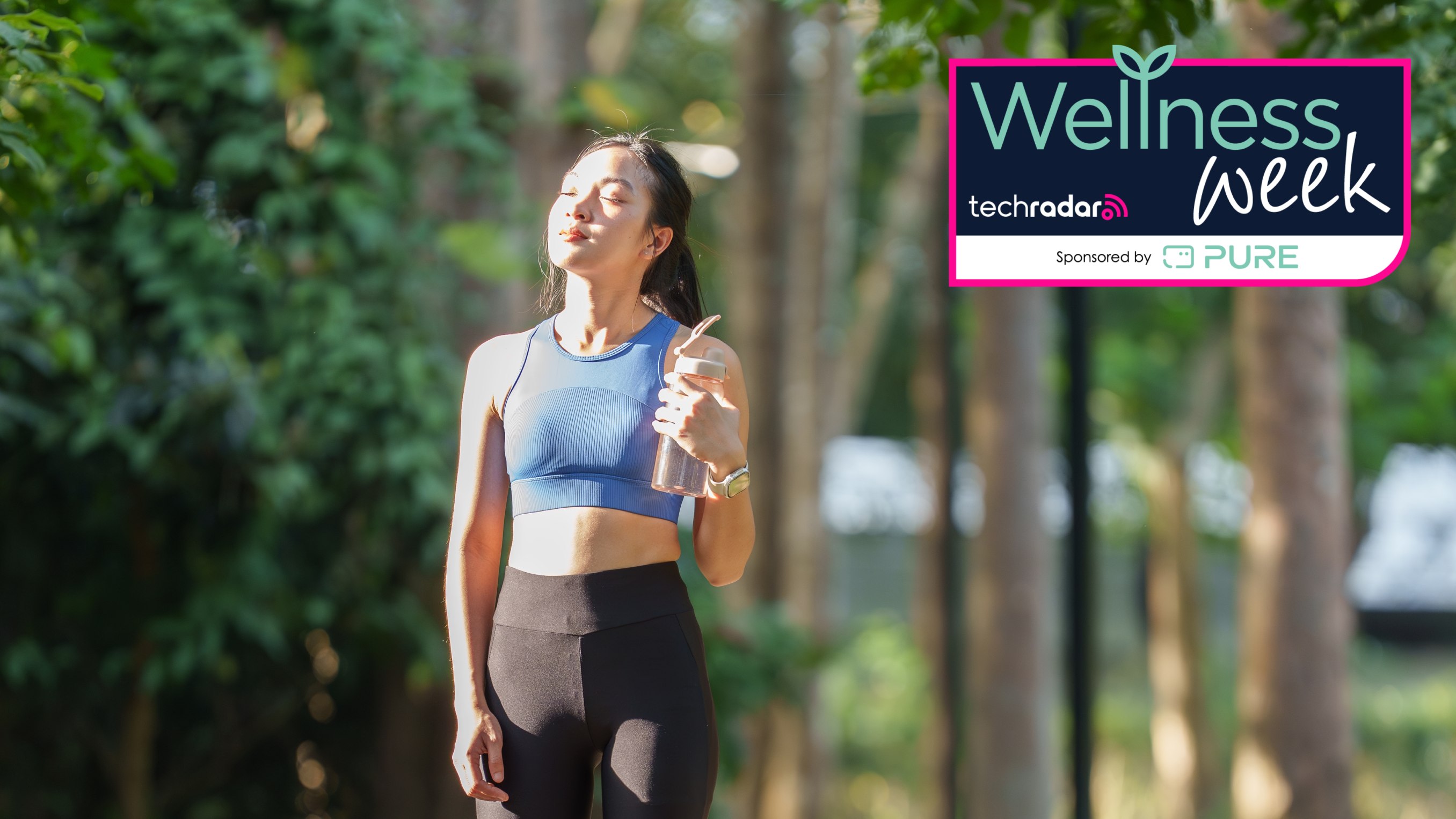 Woman walking in sunshine with water bottle