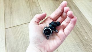 Grell Audio TWS/1 earbuds in the palm of a hand