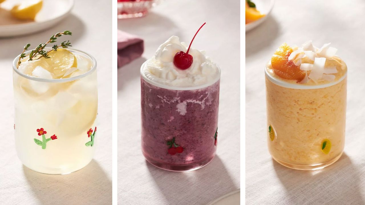 Three of the Anthropologie Juice Glasses, known as the Icon Juice Glasses, with three different themes and three different fancy drinks