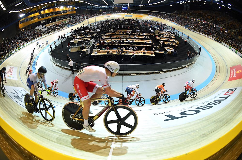 Cyclists take part in the men's Scratch final during the UCI Track Cycling World Championships in Apeldoorn