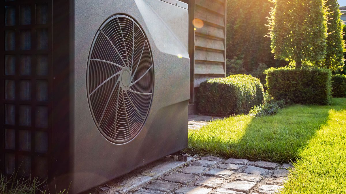 Air heat pump near pool house outdoors