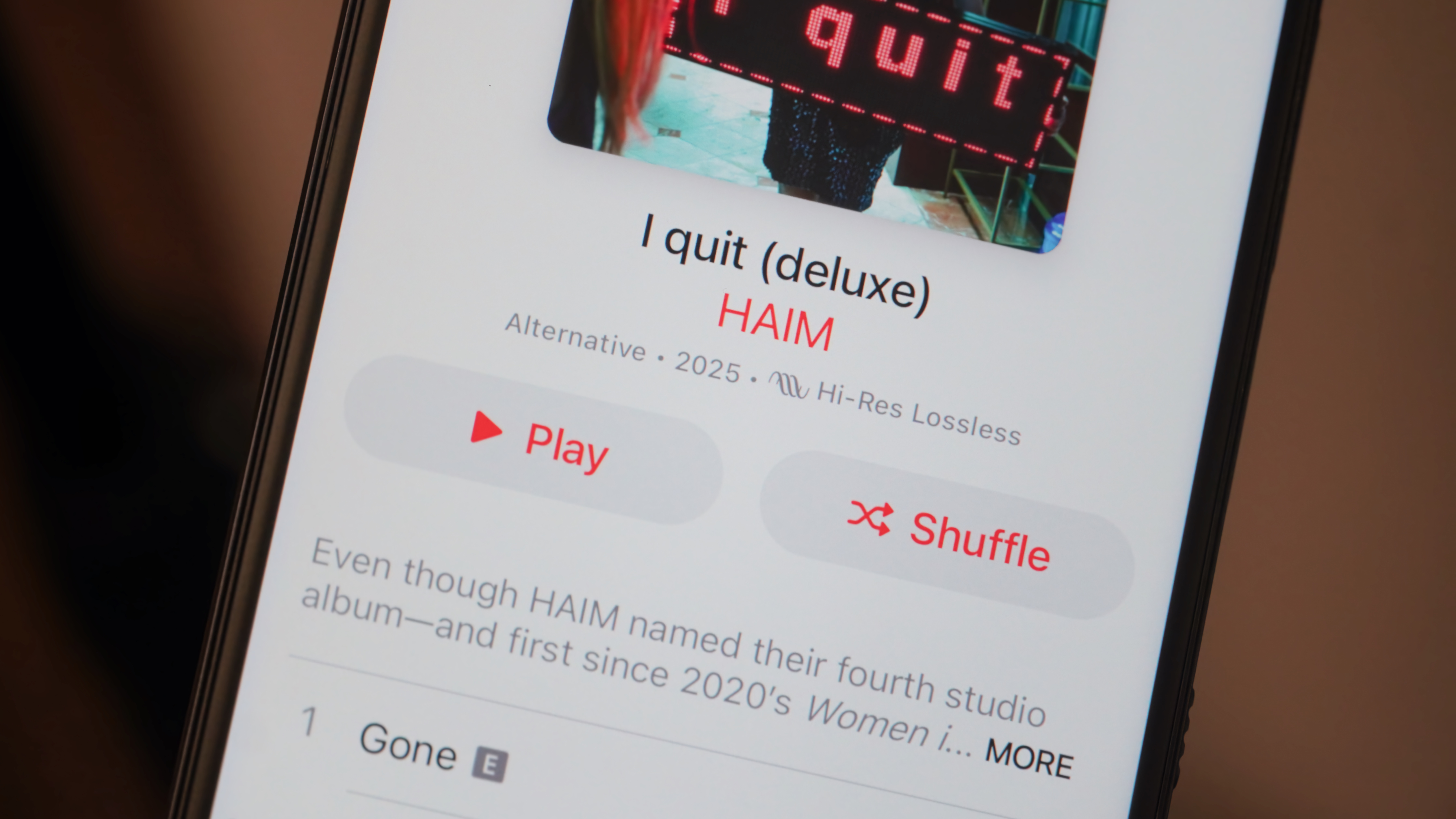 The Apple Music app running on an Android phone showing hi-res lossless quality.