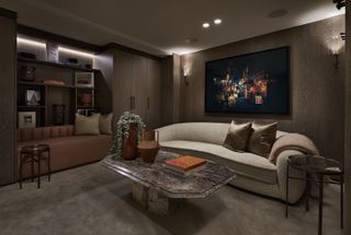 media room with curved sofa and plush carpet