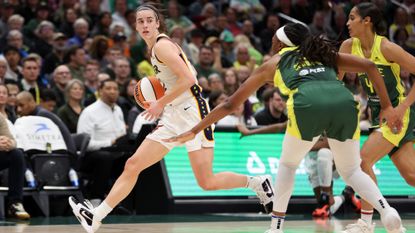 Caitlin Clark #22 of the Indiana Fever dribbles the ball during the second quarter against the Seattle Storm in the game at Climate Pledge Arena on May 22, 2024 in Seattle, Washington