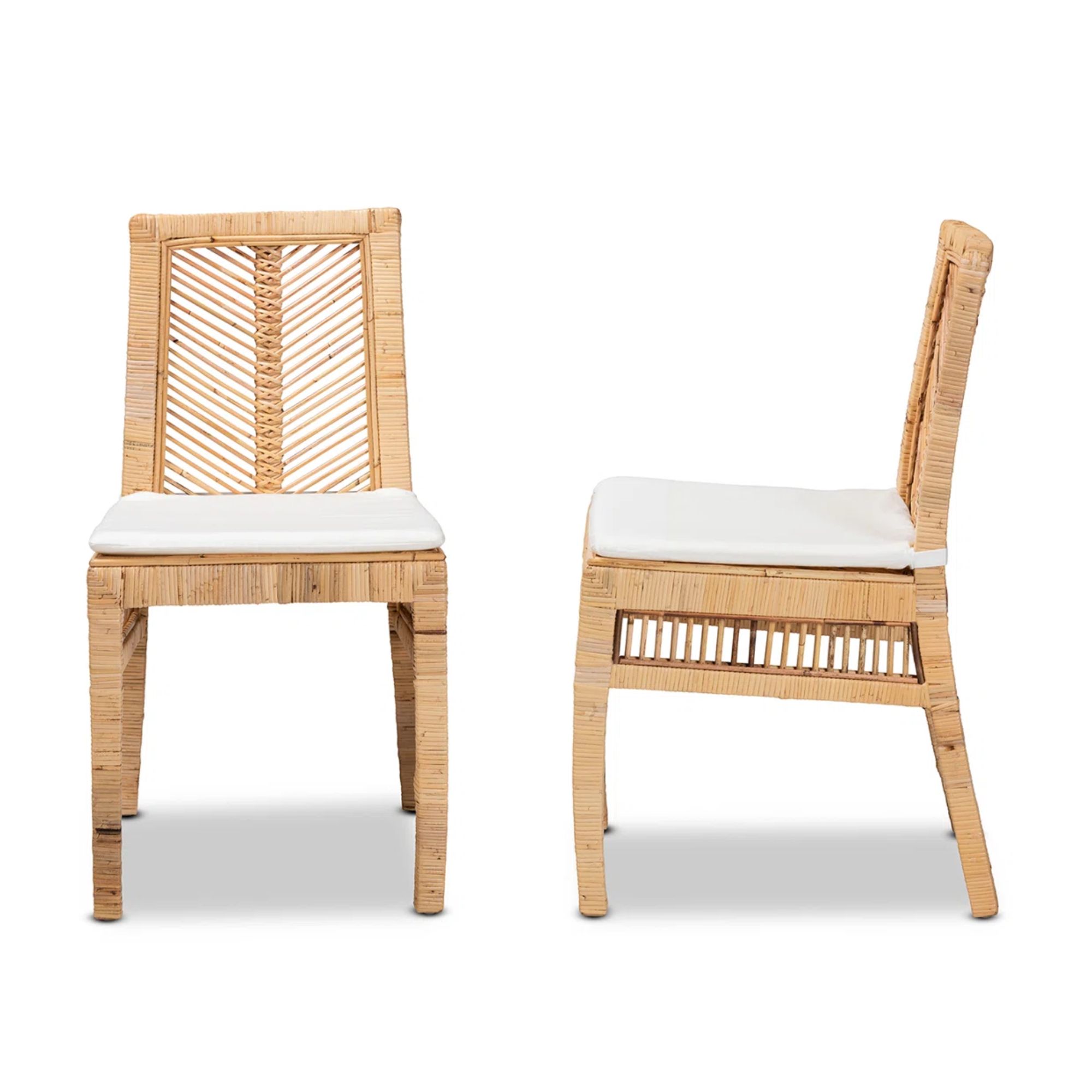 two rattan dining chairs with white seat cushion