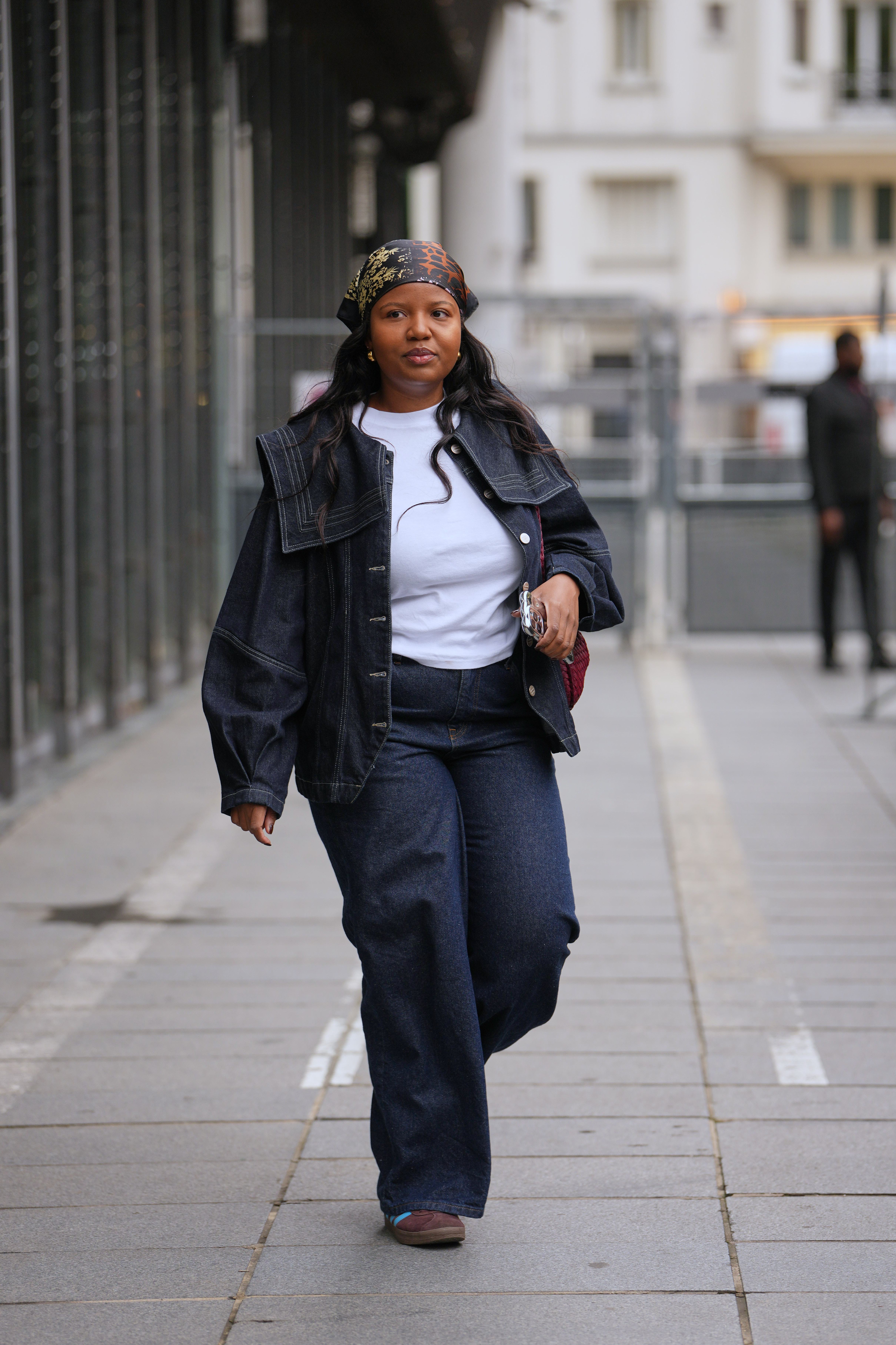 Woman in denim jacket and denim jeans