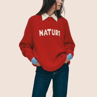 flat lay image of woman wearing red jumper