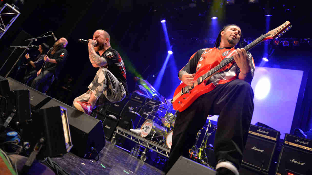 Five Finger Death Punch performing onstage in 2013