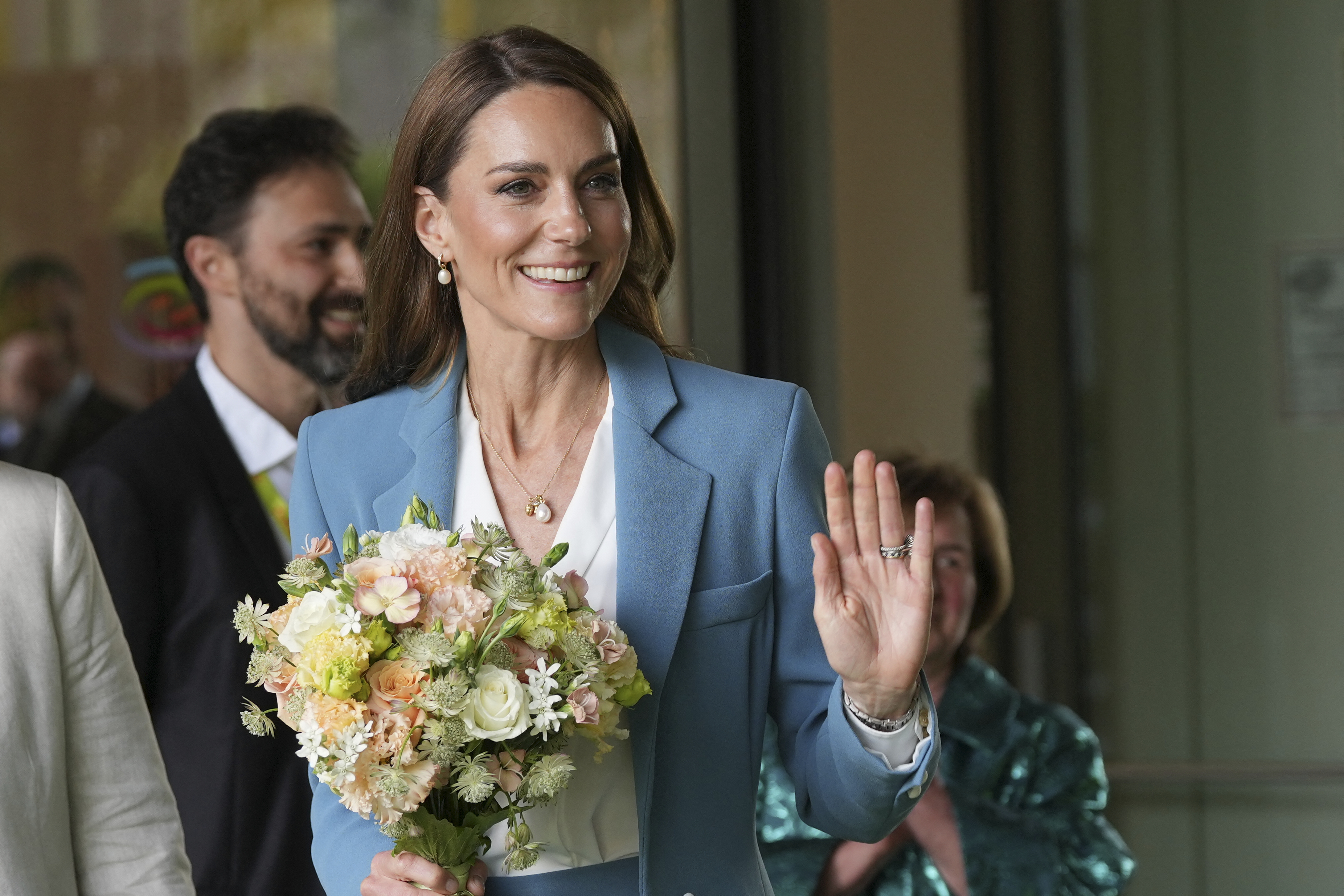 Britain's Catherine, Princess of Wales, waves leaving the Loris Malaguzzi International Centre, part of a two-day trip, in Reggio Emilia, Italy (Photo by Antonio Calanni / POOL / AFP)