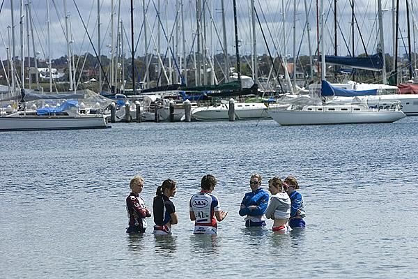 Riders from the Honda Hybrid women's tour take a dip in the cool waters of Geelong after their ride against the clock.
