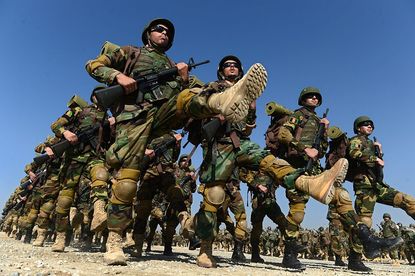 Afghan soldiers marching in uniform.