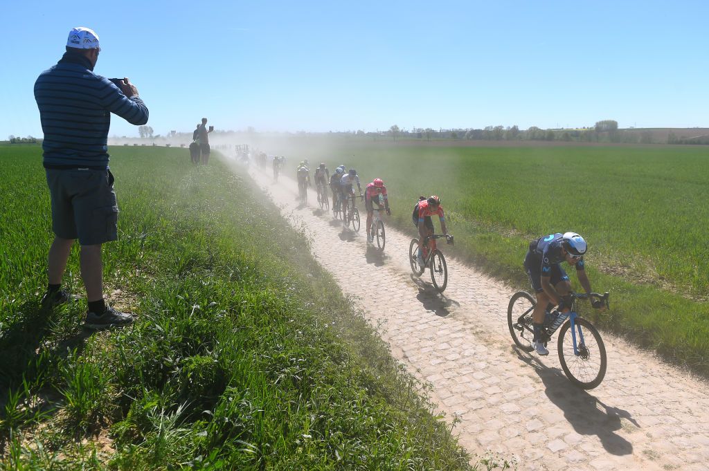 ROUBAIX FRANCE APRIL 17 LR Lukasz Wisniowski of Poland and Team EF Education Easypost Dylan Teuns of Belgium and Team Bahrain Victorious and Oier Lazkano Lopez of Spain and Movistar Team compete passing through a cobblestones sector during the 119th ParisRoubaix 2022 Mens Elite a 2572km one day race from Compigne to Roubaix ParisRoubaix WorldTour on April 17 2022 in Roubaix France Photo by Luc ClaessenGetty Images