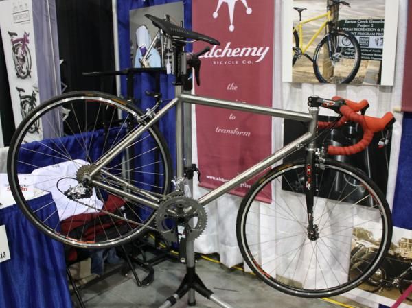 Tucked in the corner of the Alchemy booth was this elegant titanium bike.
