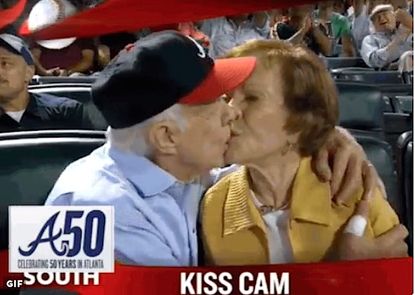 Jimmy and Rosalynn Carter kissing at a Braves game