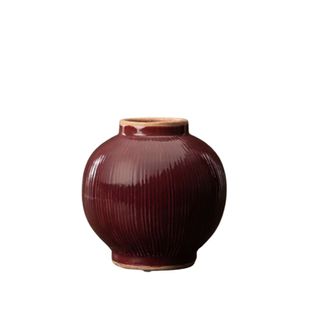 red rounded ceramic vase