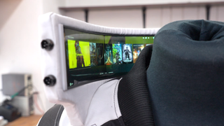Cosplayer and hardware creator Zibartas models hand-made Cyberpunk 2077 bomber jacket. The garment features a tall standing collar with flexible OLED screens housed inside it.