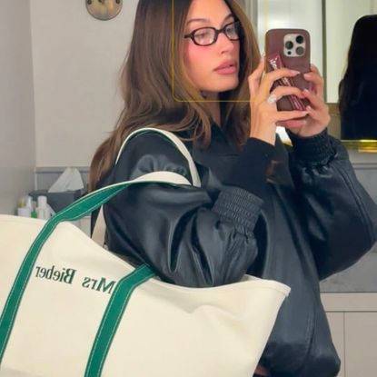 Rhode Beauty founder Hailey Bieber carries an LLBean tote bag