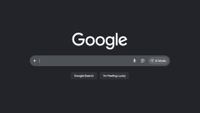 The Google search bar, with 'Google Search' and 'I'm Feeling Lucky' buttons below and a tab for 'AI mode' to the side. This is the web page in dark mode, so the Google logo is on a grey background.