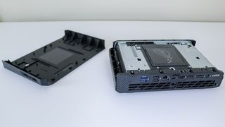 The Asus ROG NUC 970 with its case open on a desk